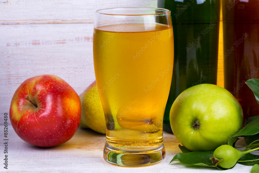 Glass and bottles of cider Glass and bottles of cider