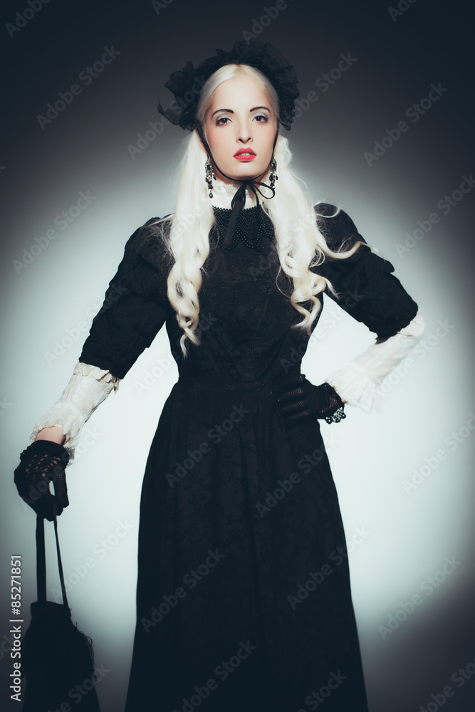 Woman in Black Victorian Gown Holding Hand Bag Woman in Black Victorian Gown Holding Hand Bag