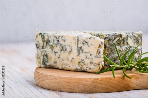 Blue cheese on wooden background