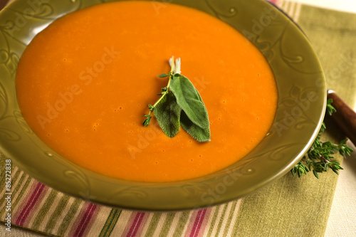 Homemade Tomato Soup with herb garnish.
