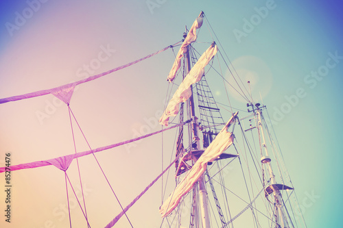 Vintage retro filtered picture of a sailing ship mast.