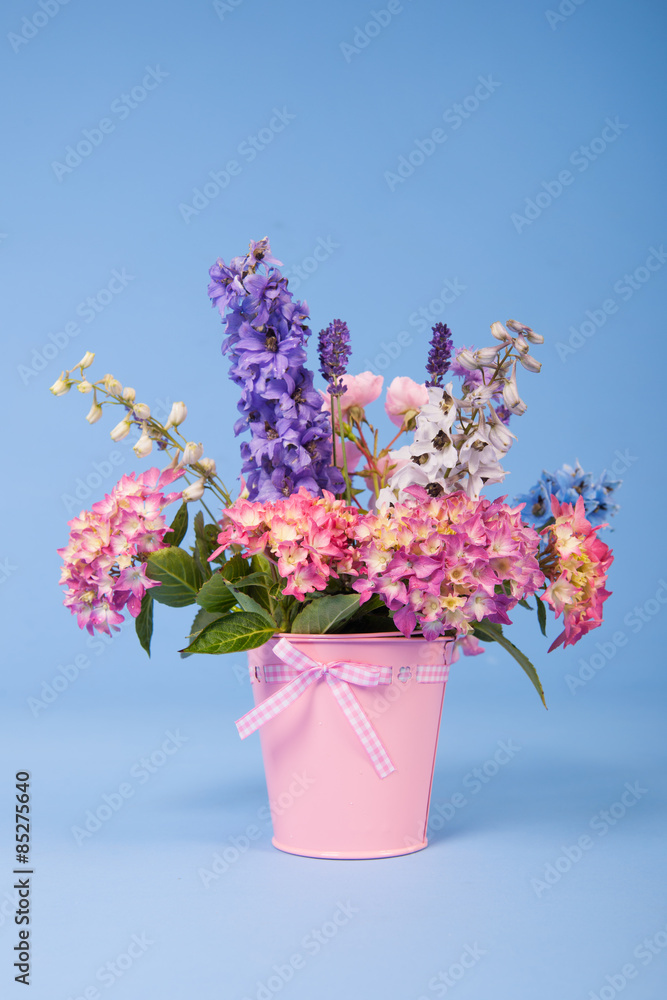 mixed colorful bouquet on blue background