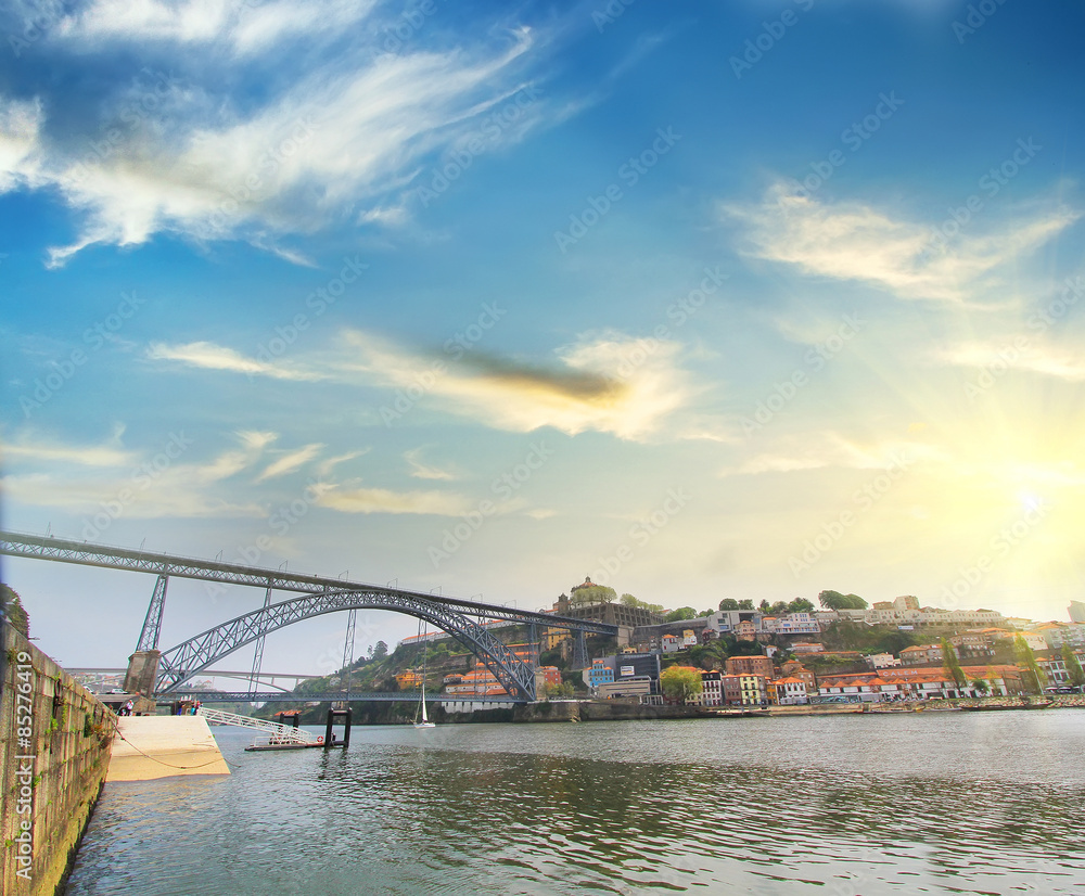Dom Luiz bridge and Porto riverside . Colorful background,  Porto , Portugal. Travel concept