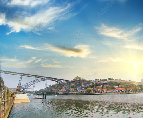 Dom Luiz bridge and Porto riverside . Colorful background,  Porto , Portugal. Travel concept