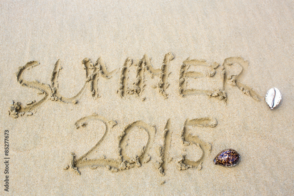 Fototapeta premium inscription on the sand word summer