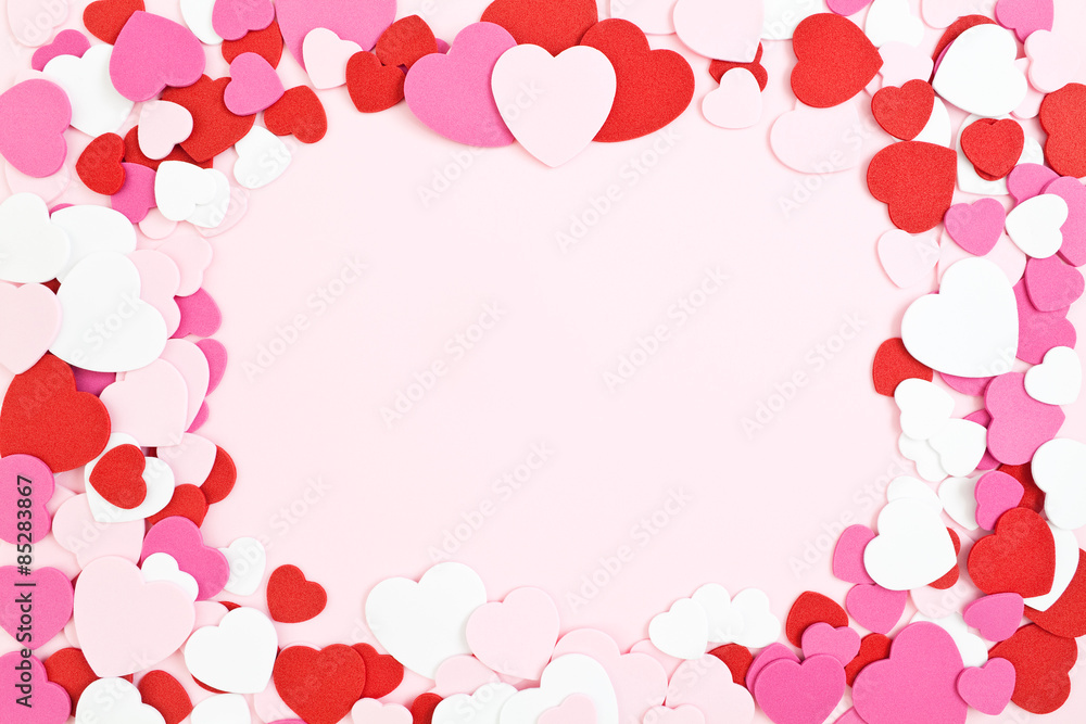Valentine's Day Border & Background, pink red and white heart shapes with copy space in the center. Valentine's Day Border & Background, pink red and white heart shapes with copy space in the center.