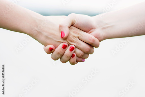 Handshake of two girls