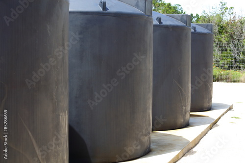 A view of water tanks lined up in a row. 