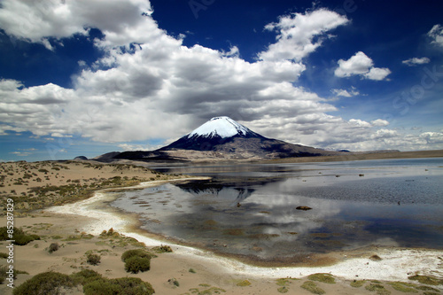 Lauca National Park, Chile, South America Volcano Parinacota and Lake Chungara in Chile's Andean range photo