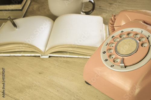 Phone vintage on wood table 