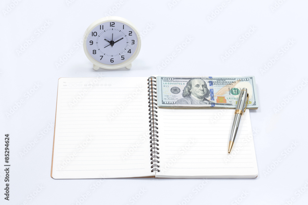 Blank notebook with clock and dollar bill for money and time con Blank notebook with clock and dollar bill for money and time con