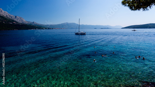 beach with clear blue water at Korcula Croatis photo