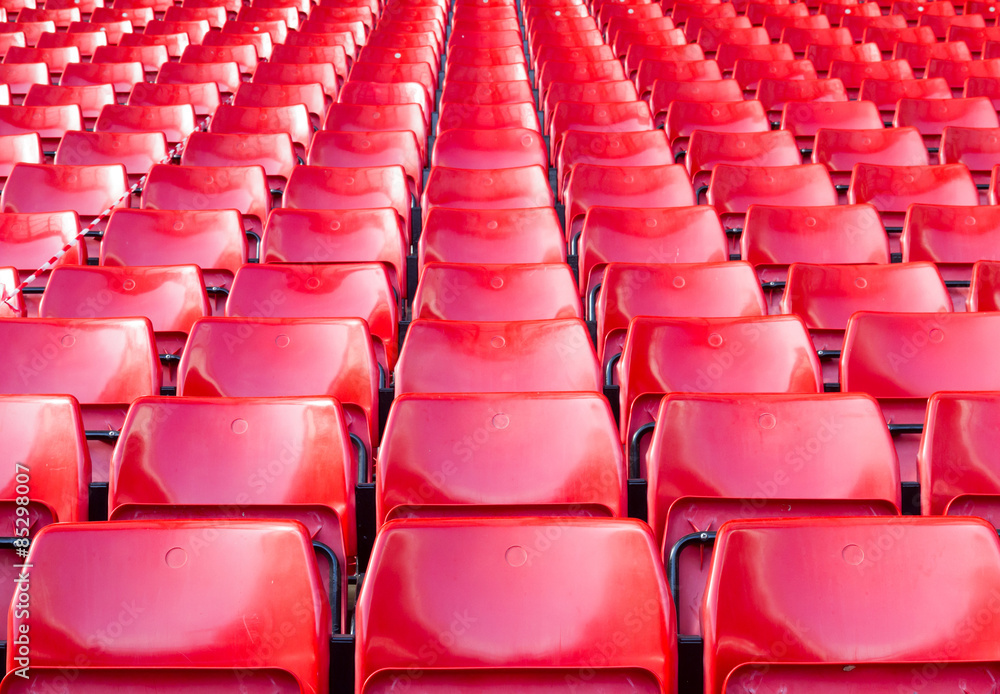 Empty seats red at stadium. Empty seats red at stadium.