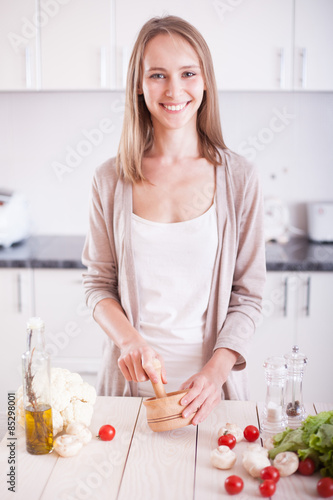 Young Woman Cooking in the kitchen