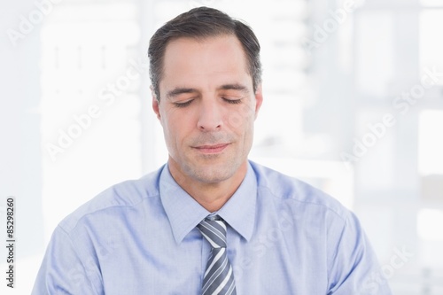 Businessman relaxing on his office  © WavebreakMediaMicro