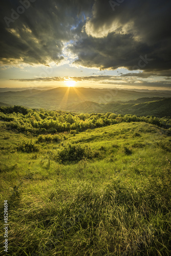 sunset above hills