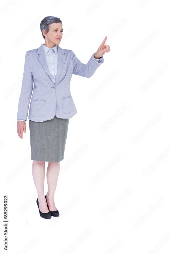 A serious businesswoman with grey hair gesturing A serious businesswoman with grey hair gesturing