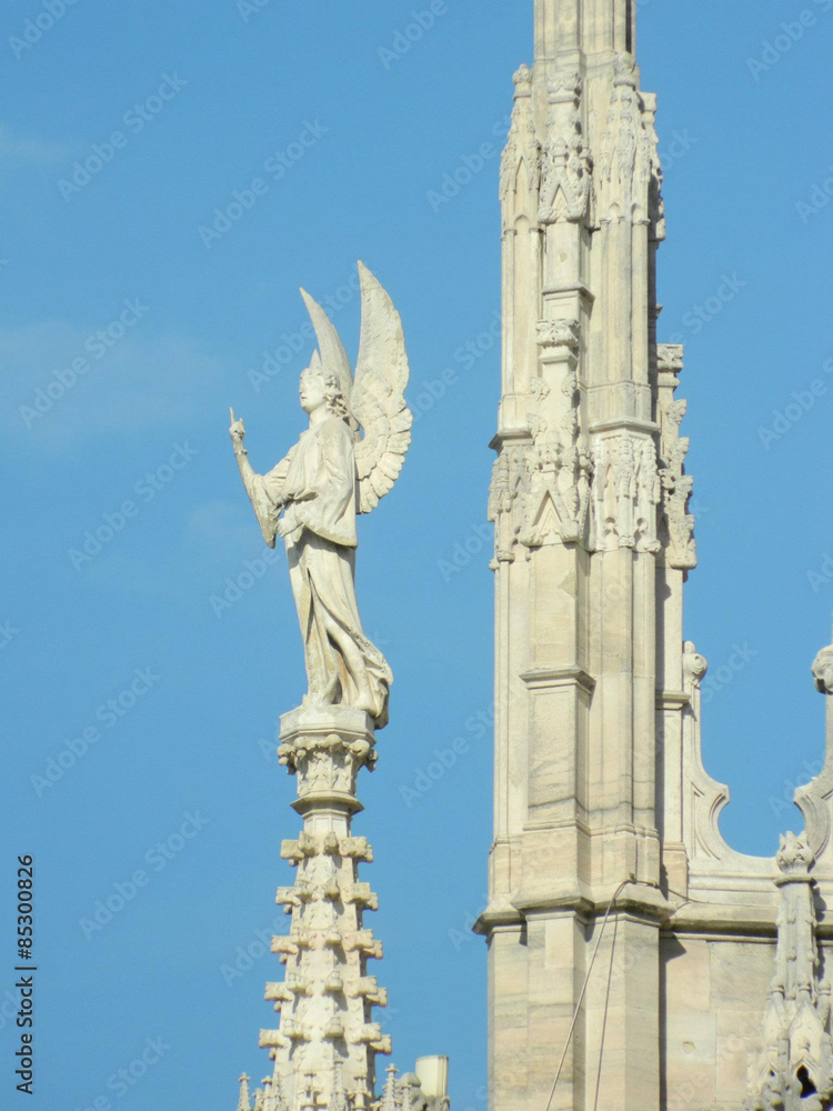 Milano Dome ( Duomo ) . Photo of statues from the roof of the Milan Duomo with amazing clear sky. Milano Dome ( Duomo ) . Photo of statues from the roof of the Milan Duomo with amazing clear sky.
