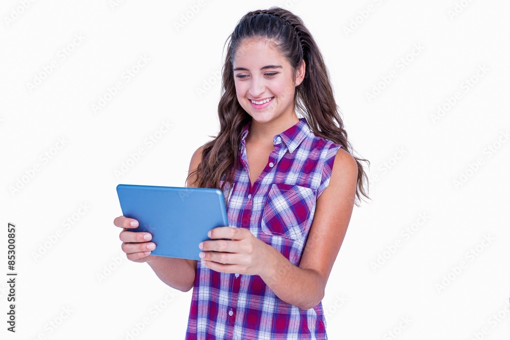 Happy pretty brunette using tablet computer Happy pretty brunette using tablet computer