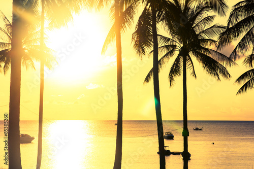 Fototapeta Naklejka Na Ścianę i Meble -  silhouette at sunset on tropical island,vintage style Thailand