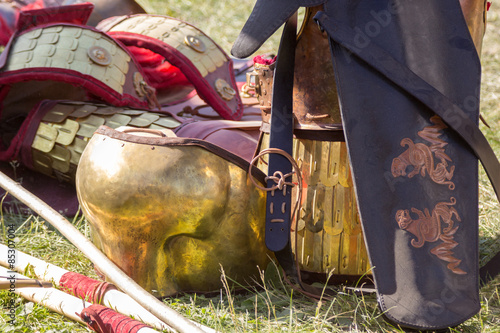 Ancient Roman armor of leather and metal lying on ground