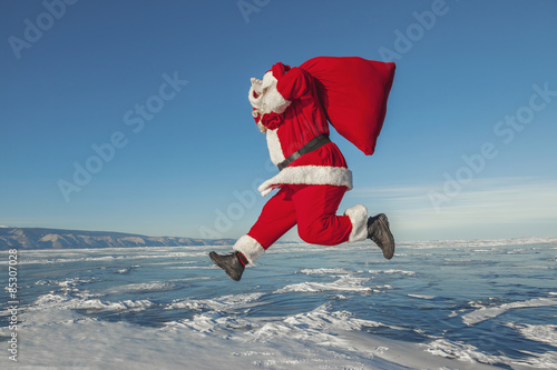Santa Claus jumping in the winter