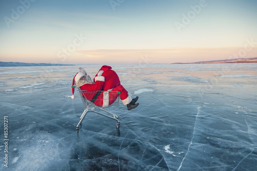 Santa Claus on winter lake ice