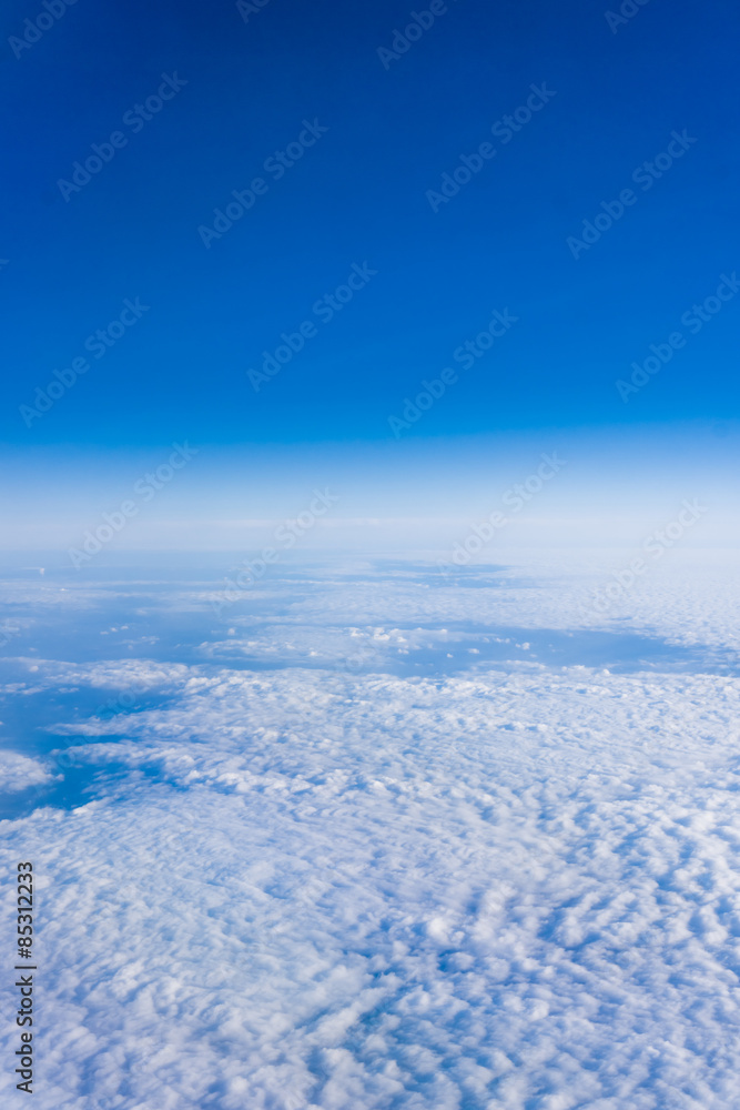 White clouds. Beautiful blue sky sea, a view from an aeroplane White clouds. Beautiful blue sky sea, a view from an aeroplane