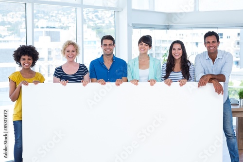 Creative team holding a panel 