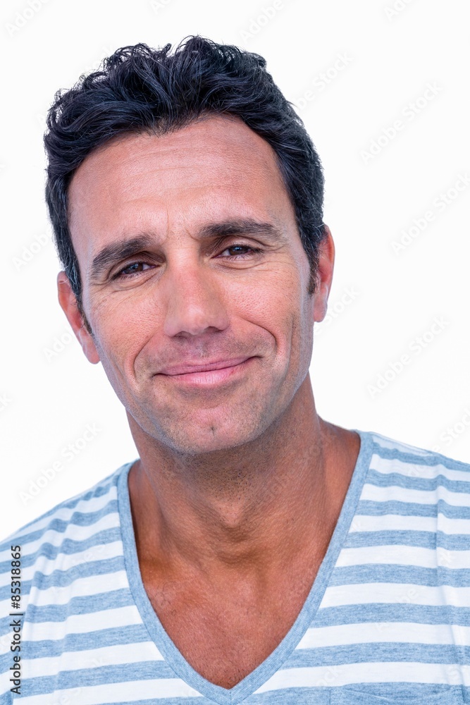 Fototapeta premium Portrait of happy man smiling at camera
