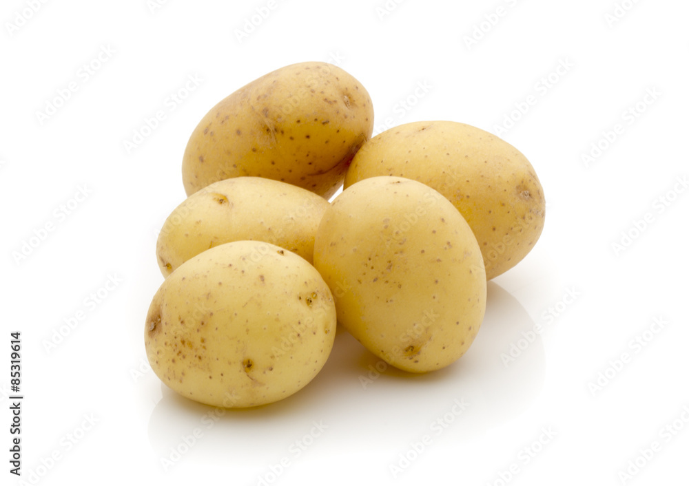 Potatoes on the white background. New harvest. Potatoes on the white background. New harvest.