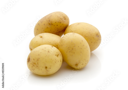 Potatoes on the white background. New harvest.