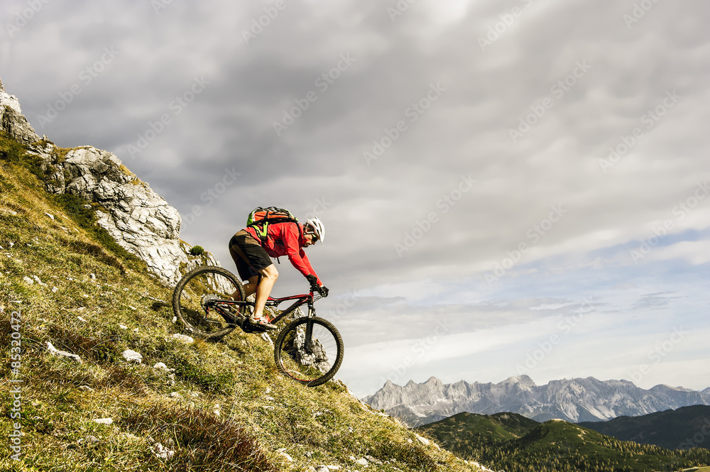 Austria, Altenmarkt-Zauchensee, young mountain biker driving at Low Tauern Austria, Altenmarkt-Zauchensee, young mountain biker driving at Low Tauern