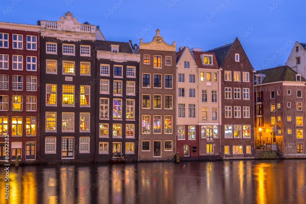 Canal houses on Damrak in Amsterdam