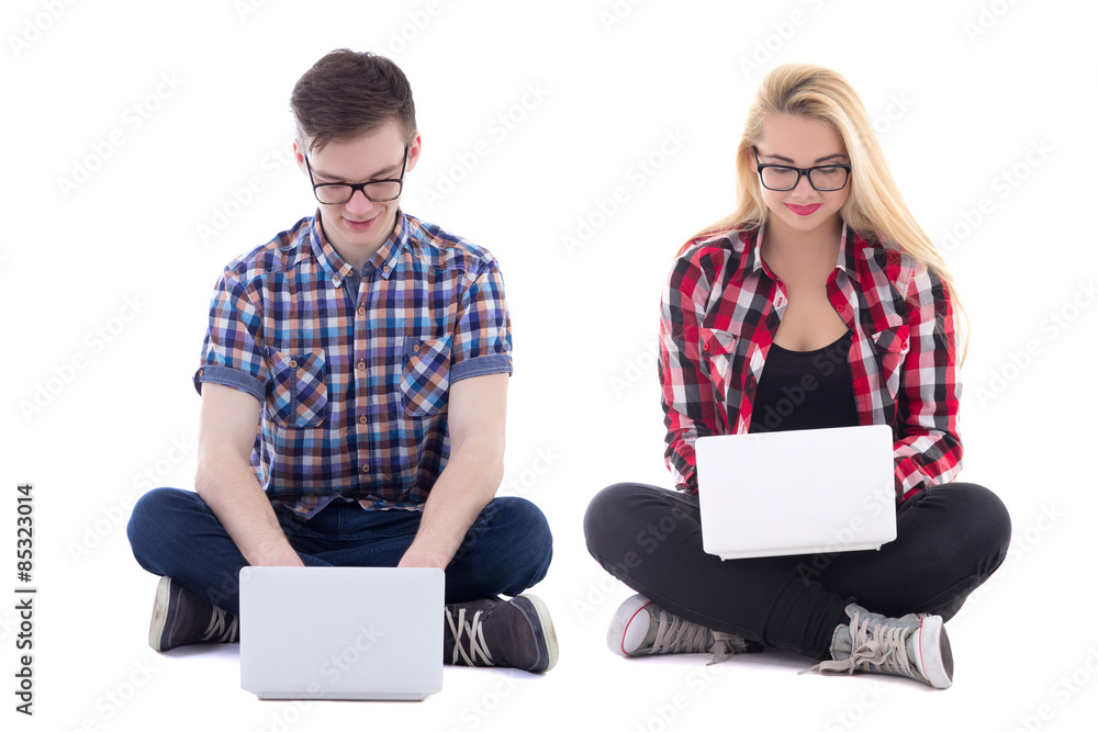 teenage girl and boy sitting with laptops isolated on white teenage girl and boy sitting with laptops isolated on white