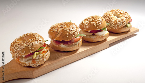Mini bagel sandwich with tomato cheese and ham 