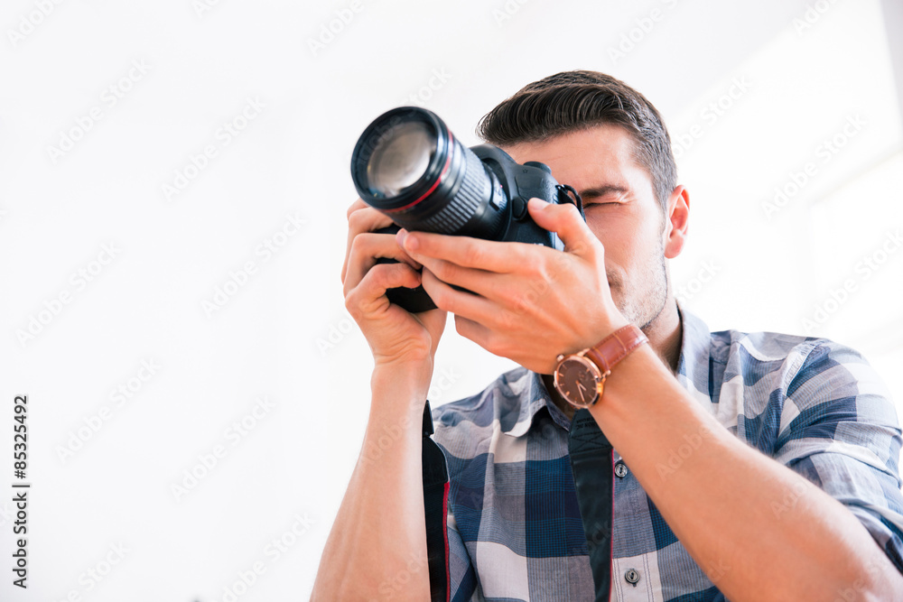 Man using photo camera Man using photo camera