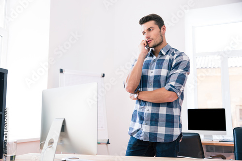 Businessman talking on the phone in office