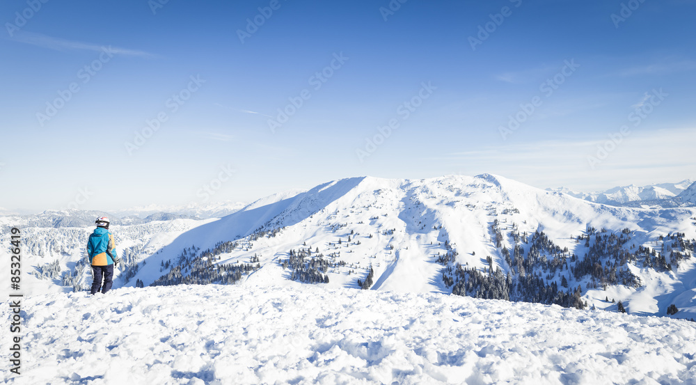 Austria, Salzburg State, Hochkoenig Region, young female skier looking to mountains Austria, Salzburg State, Hochkoenig Region, young female skier looking to mountains