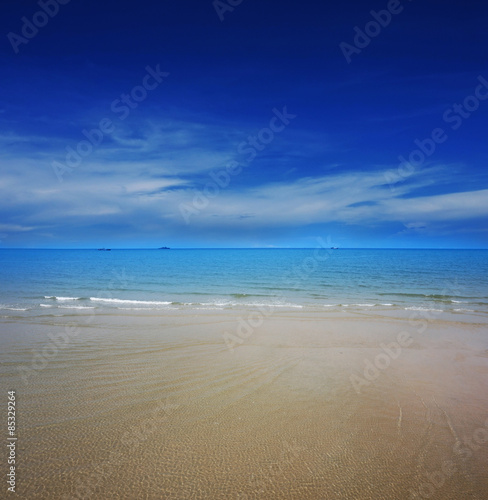 Clear water on the beach with blue sky