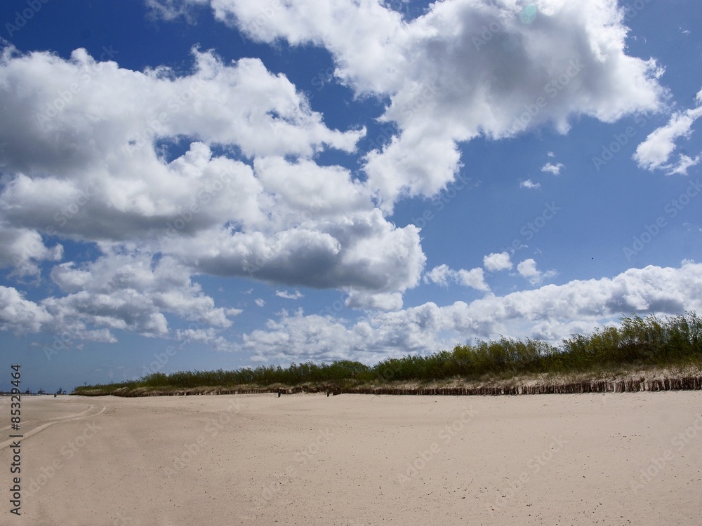 blue sky with clouds and sandy Baltic beach blue sky with clouds and sandy Baltic beach