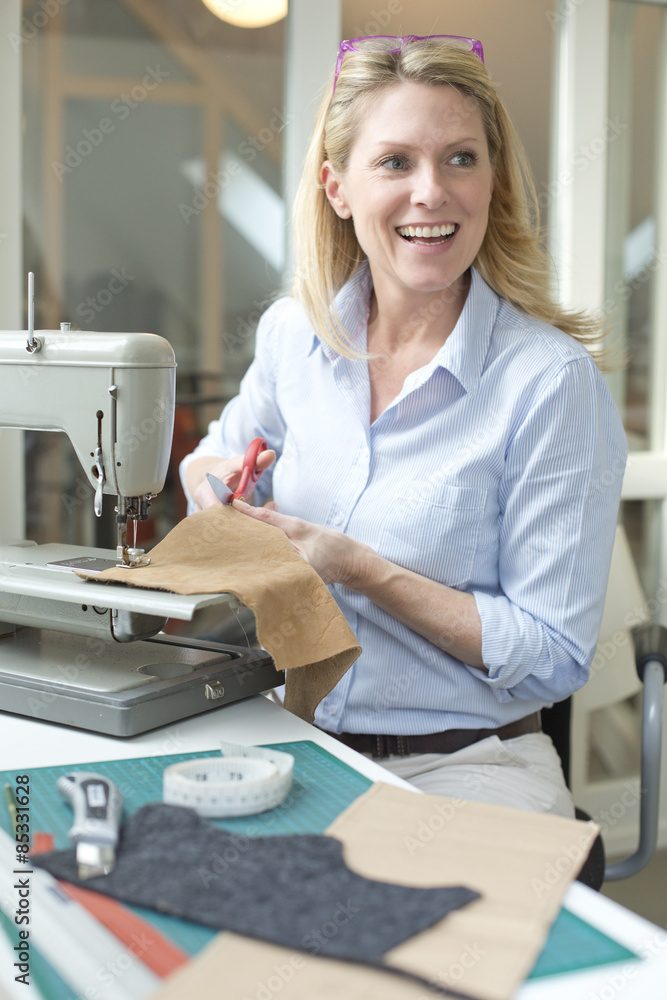 Smiling woman tailoring Smiling woman tailoring