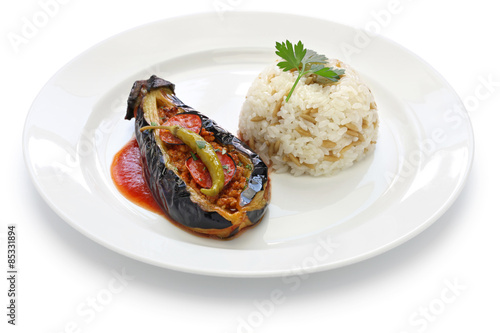 karniyarik pilav, stuffed eggplant with pilaf, turkish cuisine isolated on white background photo