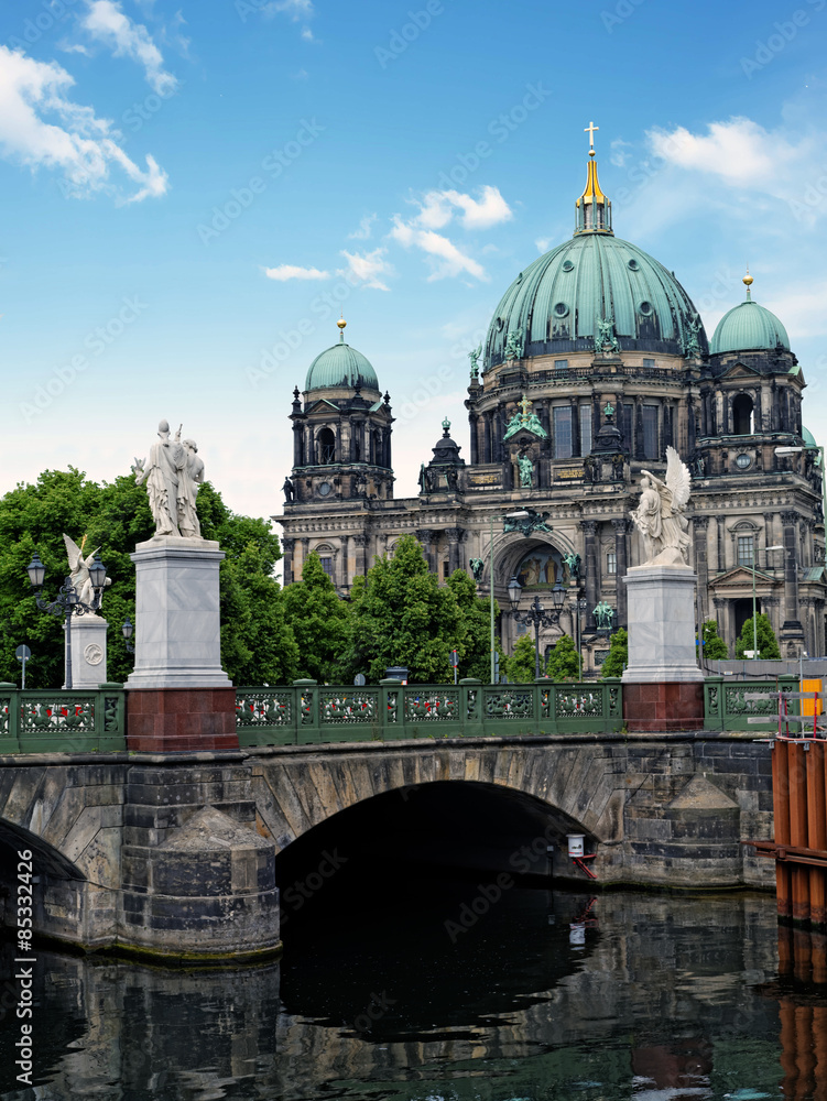 Palace Bridge (Schlossbruecke) over a western branch of the Spree River with Berlin Cathedral in the background
