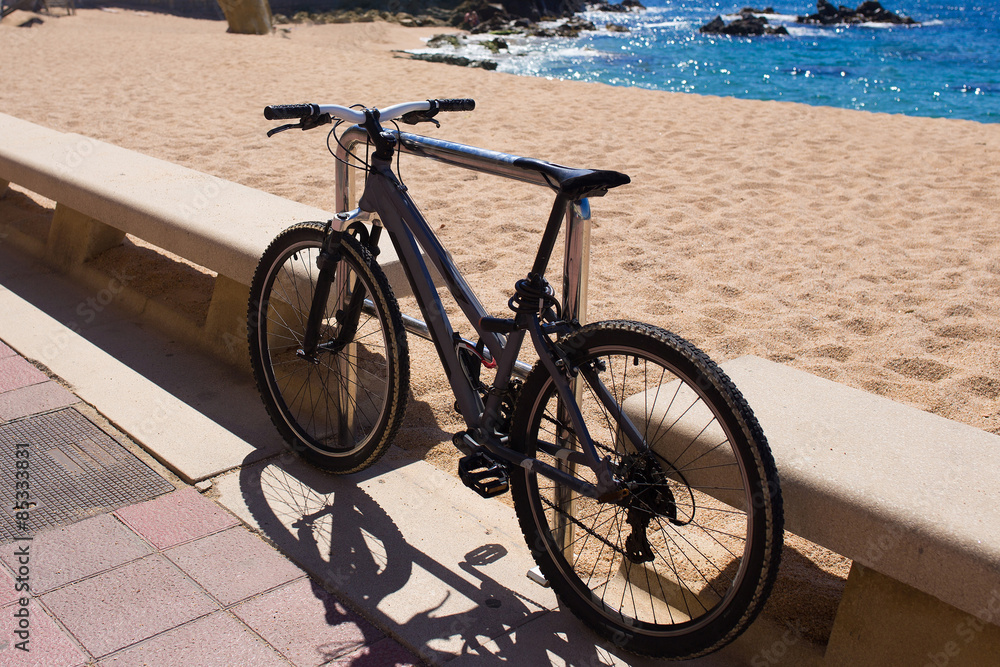 Bicycle standing near the beach. Ecological tourism. Summer sea