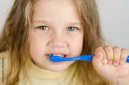 Close-up of a girl cleaning teeth