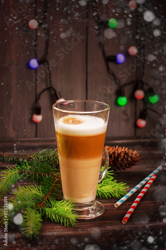 Latte macchiato - italian coffee beverage, Christmas card. Selective focus. Toned image