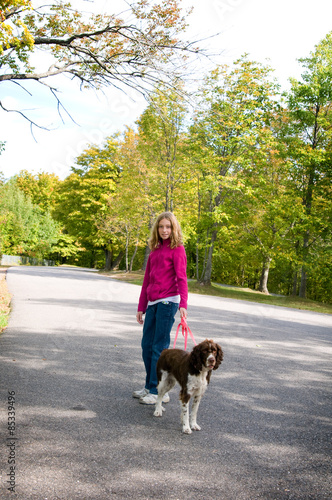 young girl walking her dog © sianc