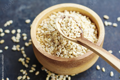 Wooden bowl of parboiled wheat berries photo