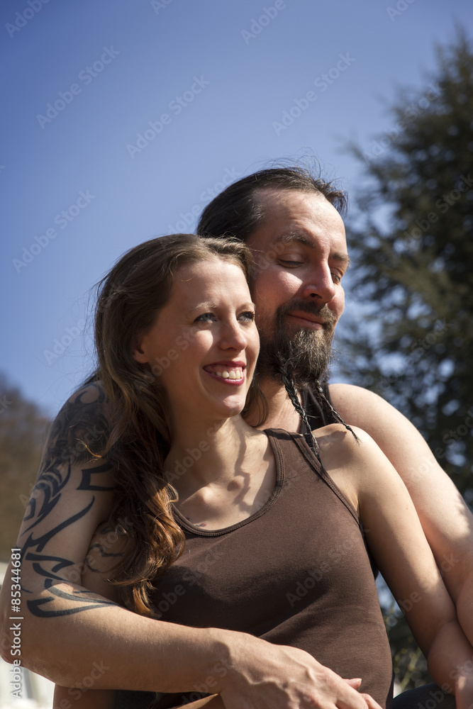Happy man and woman embracing outdoors Happy man and woman embracing outdoors